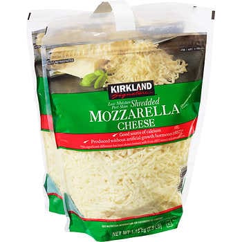 Shredded Mozzarella Cheese in a Plastic Container Stock Photo